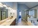 Elegant bathroom with double vanity, and glass enclosed shower at 151 Creek Bank Dr, Acworth, GA 30101