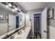Well-lit bathroom with double sinks, sleek fixtures, and a glass door shower at 151 Creek Bank Dr, Acworth, GA 30101