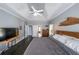 Inviting bedroom featuring a tray ceiling, hardwood floors, and generous natural light at 151 Creek Bank Dr, Acworth, GA 30101