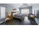 Spacious bedroom with tray ceiling, shutters, and dark hardwood floors at 151 Creek Bank Dr, Acworth, GA 30101
