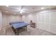 A full-sized ping pong table sits in the middle of this finished game room, with plenty of space for entertaining at 151 Creek Bank Dr, Acworth, GA 30101