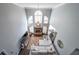 A sun-soaked living room with soaring ceilings, a charming fireplace, and a comfortable, oversized sectional at 151 Creek Bank Dr, Acworth, GA 30101