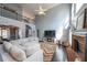 Spacious living room with vaulted ceilings, fireplace, and open layout to dining area and stairs at 151 Creek Bank Dr, Acworth, GA 30101