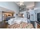 Open-concept living room with vaulted ceilings, fireplace, and kitchen access at 151 Creek Bank Dr, Acworth, GA 30101