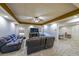 A sprawling living room area with plush seating, a television, and convenient access to the game room at 151 Creek Bank Dr, Acworth, GA 30101