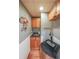 A charming finished basement wet bar features wood cabinets and a fun sports themed decoration at 151 Creek Bank Dr, Acworth, GA 30101