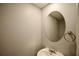 Half bathroom featuring neutral colors, white fixtures, brushed nickel towel holder and lighting at 3301 Henderson Mill Rd # F1, Atlanta, GA 30341