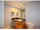 Bathroom with a sink, large mirror with vanity lighting and tiled flooring at 3301 Henderson Mill Rd # F1, Atlanta, GA 30341