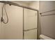 Bathroom shower with sliding glass door and tile and a towel rack at 3301 Henderson Mill Rd # F1, Atlanta, GA 30341