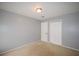 Bedroom with neutral paint, plush carpet and a double door closet at 3301 Henderson Mill Rd # F1, Atlanta, GA 30341