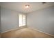 Bedroom with plush carpet and a window letting in natural light and neutral colored paint at 3301 Henderson Mill Rd # F1, Atlanta, GA 30341