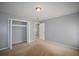 Neutral bedroom featuring a closet and doorway to an adjacent room at 3301 Henderson Mill Rd # F1, Atlanta, GA 30341