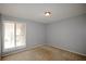 Bedroom featuring plush carpet, a window with blinds and neutral colored walls at 3301 Henderson Mill Rd # F1, Atlanta, GA 30341