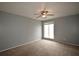 Bedroom featuring neutral carpet, a window letting in natural light and neutral paint at 3301 Henderson Mill Rd # F1, Atlanta, GA 30341