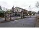 Entrance to Henderson Park with black iron gates and stone pillars at 3301 Henderson Mill Rd # F1, Atlanta, GA 30341