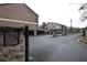 Entrance gate with stone pillars and a secure call box at 3301 Henderson Mill Rd # F1, Atlanta, GA 30341