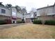 Attractive townhomes with brick and stucco exteriors, neat landscaping, and individual driveways offer curb appeal at 3301 Henderson Mill Rd # F1, Atlanta, GA 30341