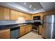 Kitchen featuring stainless steel appliances, tile floors, wooden cabinets and granite countertops at 3301 Henderson Mill Rd # F1, Atlanta, GA 30341