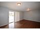 Bright living room featuring hardwood floors and sliding door to the outside at 3301 Henderson Mill Rd # F1, Atlanta, GA 30341