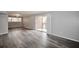 Spacious living area features new flooring, gray paint, a large sliding glass door and lots of natural light at 3301 Henderson Mill Rd # F1, Atlanta, GA 30341
