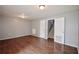 Spacious living room with hardwood floors and views of the stairs at 3301 Henderson Mill Rd # F1, Atlanta, GA 30341