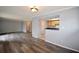 Bright open concept living room with modern flooring, neutral paint colors, bar seating and lots of natural light at 3301 Henderson Mill Rd # F1, Atlanta, GA 30341