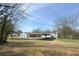 Extensive backyard featuring shed and carport, providing ample space and functionality at 5205 Dunmoreland Ct, Atlanta, GA 30349