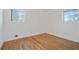 Bright bedroom features hardwood floors and ample natural light from two windows at 5205 Dunmoreland Ct, Atlanta, GA 30349