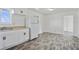 Bright kitchen with white cabinetry, new appliances, and sleek flooring with great natural light at 5205 Dunmoreland Ct, Atlanta, GA 30349