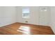 Bright living room featuring gleaming hardwood floors, fresh paint, and natural light at 5205 Dunmoreland Ct, Atlanta, GA 30349