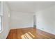 Inviting living room featuring gleaming hardwood floors, fresh paint, and a bright and airy ambiance at 5205 Dunmoreland Ct, Atlanta, GA 30349