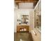 Modern bathroom featuring a glass shower, floating vanity with exposed brick accents providing a unique design at 170 Boulevard Se # H523, Atlanta, GA 30312