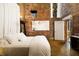 Stylish bedroom features exposed brick walls, a modern bed, and natural light streaming through the window at 170 Boulevard Se # H523, Atlanta, GA 30312
