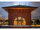 Architectural detail with arched window, brickwork, and city view in the background at 170 Boulevard Se # H523, Atlanta, GA 30312