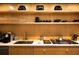 Well-organized kitchen with light wood cabinets, open shelves, stainless steel appliances, and ample counter space at 170 Boulevard Se # H523, Atlanta, GA 30312