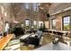 Expansive living room features exposed brick walls, large windows, and modern decor at 170 Boulevard Se # H523, Atlanta, GA 30312
