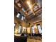 Spacious living room features exposed brick walls, high ceilings with wooden beams, and large windows for ample natural light at 170 Boulevard Se # H523, Atlanta, GA 30312