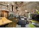 Comfortable living room with exposed brick, accent plants, and an open concept layout at 170 Boulevard Se # H523, Atlanta, GA 30312