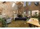 Spacious living room with exposed brick, offering a blend of rustic and modern design at 170 Boulevard Se # H523, Atlanta, GA 30312