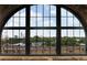 Large arched window offers breathtaking views of the city skyline and a glimpse of the surrounding landscape at 170 Boulevard Se # H523, Atlanta, GA 30312
