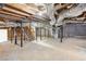 This unfinished basement features high ceilings, exposed ductwork, and sturdy support beams at 2654 Jefferson Ter, Atlanta, GA 30344