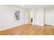An open bedroom with gleaming hardwood floors leading to the bathroom and closets at 2654 Jefferson Ter, Atlanta, GA 30344