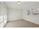 Bright, carpeted bedroom with a closet, white walls, and natural light from the window at 2654 Jefferson Ter, Atlanta, GA 30344