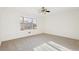 Bright bedroom with a large window and a ceiling fan above the carpeted floor at 2654 Jefferson Ter, Atlanta, GA 30344