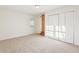Bedroom featuring a carpeted floor, a closet with double doors, and a door that goes outside at 2654 Jefferson Ter, Atlanta, GA 30344