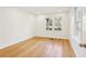 An airy bedroom featuring hardwood floors and natural light from two windows at 2654 Jefferson Ter, Atlanta, GA 30344