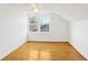 Bedroom with hardwood floors, white walls, ceiling fan and natural light from the windows at 2654 Jefferson Ter, Atlanta, GA 30344