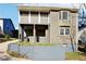 Two-story home featuring a covered porch, neutral siding, bay window, and a partially finished basement at 2654 Jefferson Ter, Atlanta, GA 30344