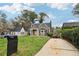 Home exterior showcasing the front yard, a long driveway, and a manicured lawn at 2654 Jefferson Ter, Atlanta, GA 30344