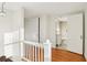 Upstairs hallway showing hardwood floors, white walls, and a partially visible bathroom at 2654 Jefferson Ter, Atlanta, GA 30344